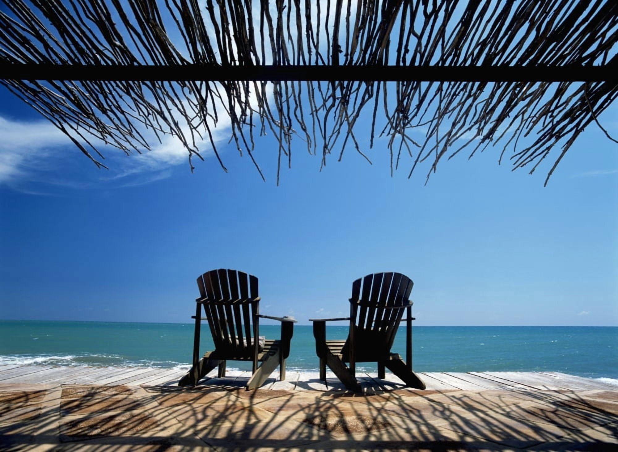 Two Chairs On Deck By Ocean Shaded By Grass Roof Canvas Art - Ian Cumming Design Pics (36 x 26)