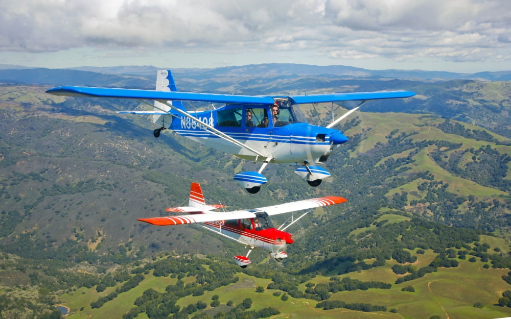 Two Champion Aircraft Citabrias in flight Canvas Art - Scott GermainStocktrek Images (36 x 22)