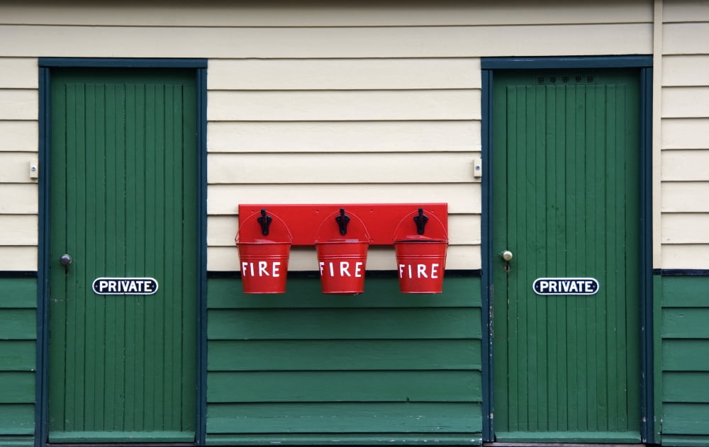 Two Doors And Buckets For Fire Prevention Canvas Art - John Short Design Pics (18 x 11)