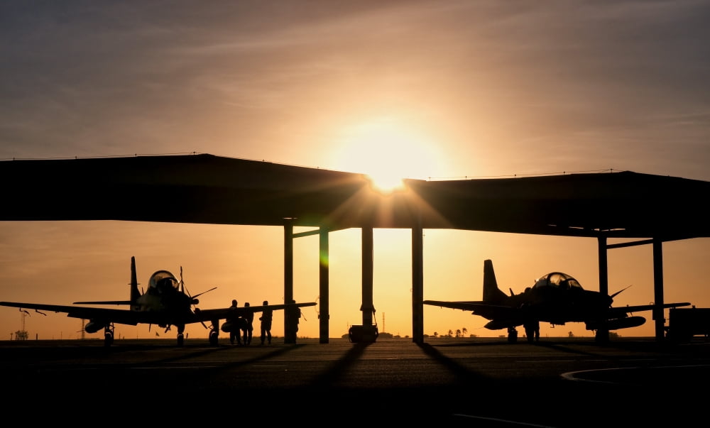 Two Embraer A-29 Super Tucano aircraft parked in the hangar at Natal Air Force Base Brazil Canvas Art - Giovanni CollaStocktrek Images (19 x 11)