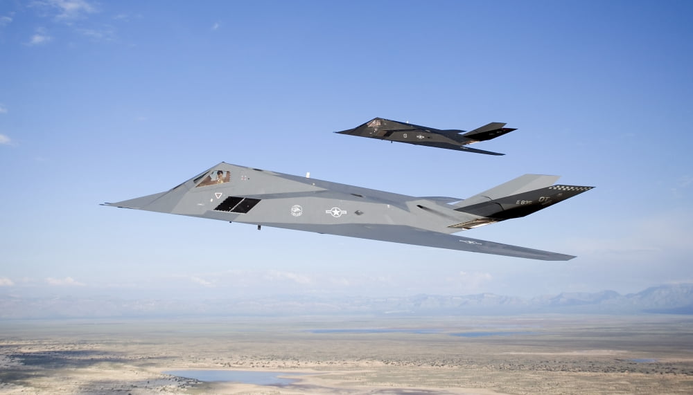 Two F-117 Nighthawk stealth fighters in flight over New Mexico Canvas Art - HIGH-G ProductionsStocktrek Images (38 x 22)