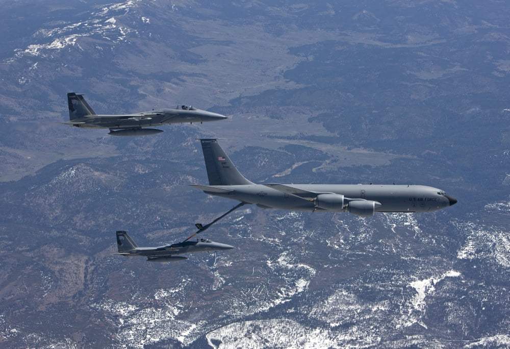 Two F-15 Eagles conduct aerial refueling with a KC-135 Stratotanker Canvas Art - HIGH-G ProductionsStocktrek Images (35 x 24)