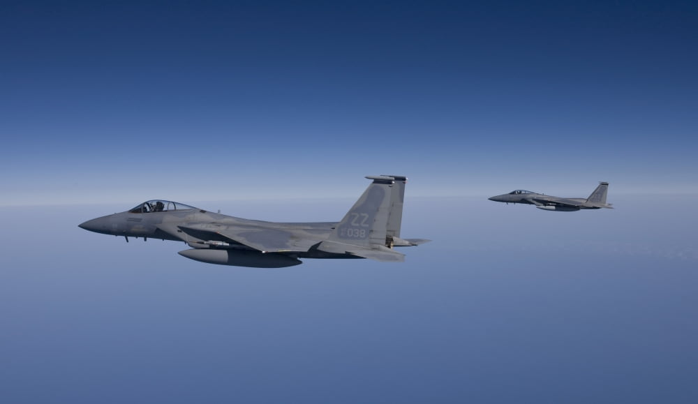 Two F-15 Eagles fly over the Gulf of Mexico Canvas Art - HIGH-G ProductionsStocktrek Images (19 x 11)