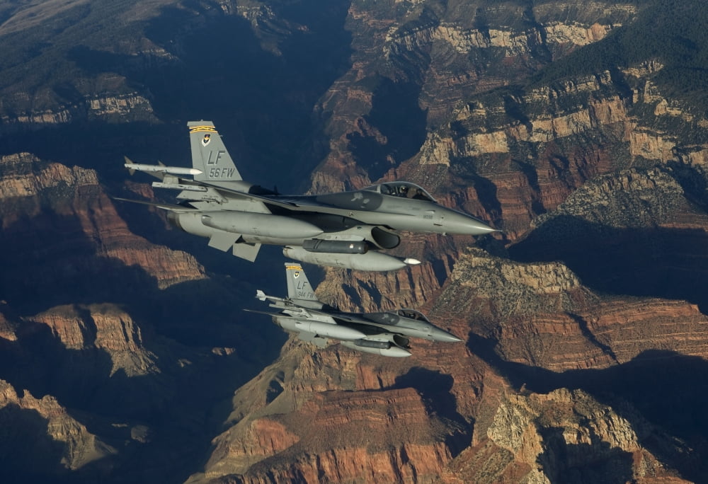 Two F-16s fly in formation over the Grand Canyon Arizona Canvas Art - HIGH-G ProductionsStocktrek Images (18 x 12)