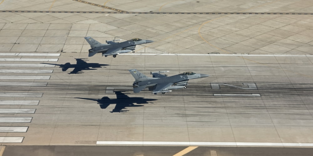 Two F-16s land in formation at Luke Air Force Base Arizona Canvas Art - HIGH-G ProductionsStocktrek Images (20 x 10)