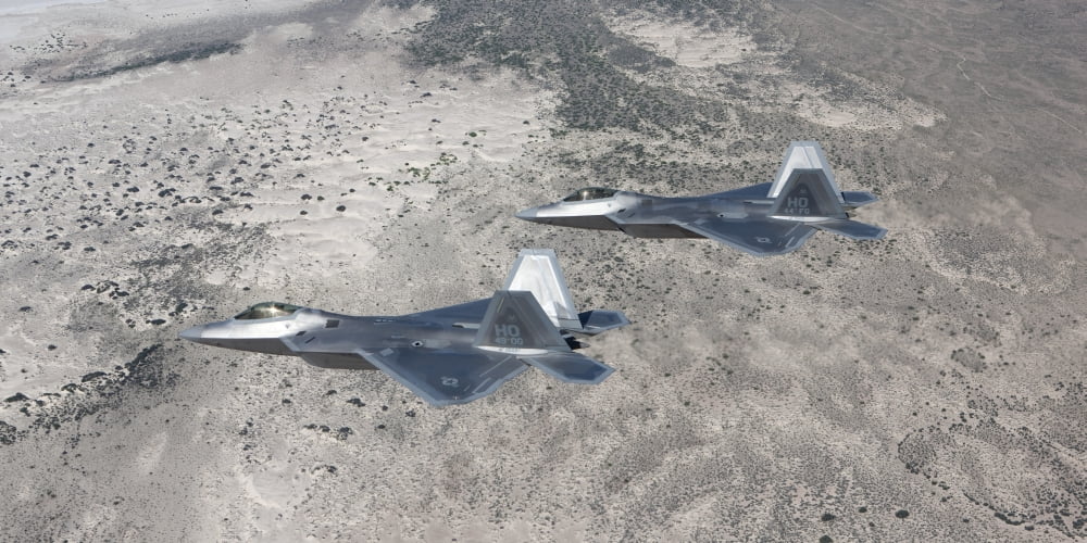 Two F-22 Raptors fly a training mission over New Mexico Canvas Art - HIGH-G ProductionsStocktrek Images (20 x 10)