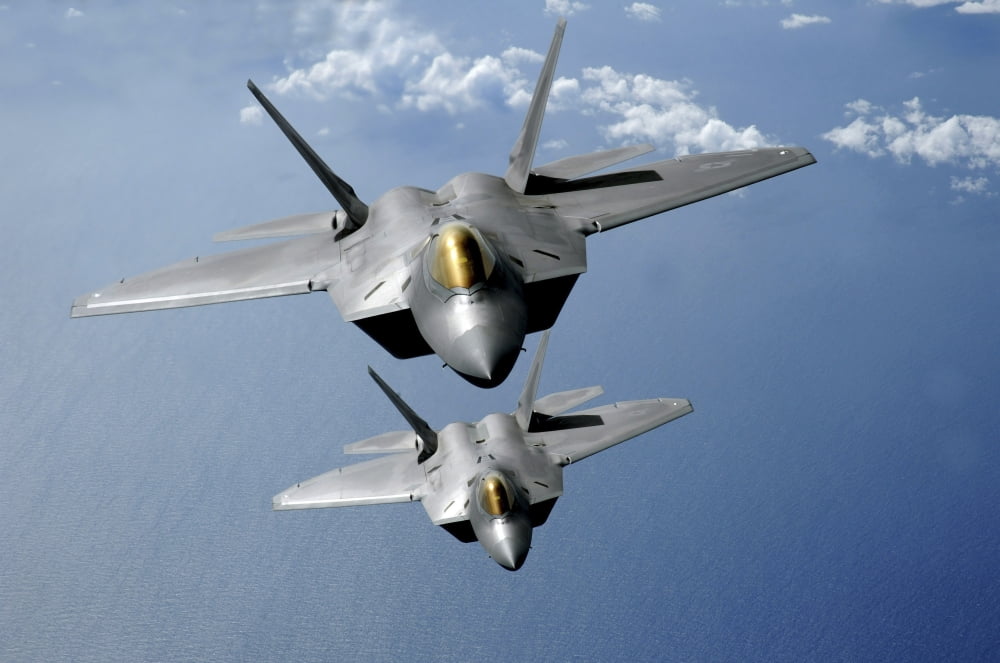Two F-22 Raptors fly over the Pacific Ocean Canvas Art - Stocktrek Images (35 x 23)