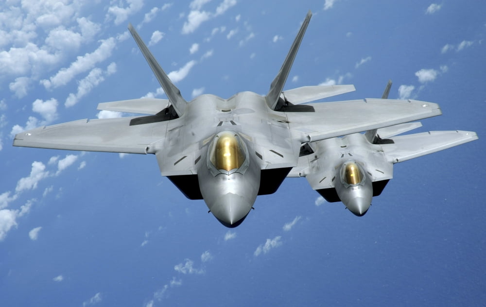 Two F-22 Raptors fly over the Pacific Ocean Canvas Art - Stocktrek Images (36 x 23)