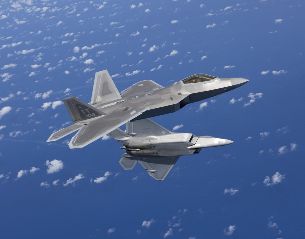 Two F-22 Raptors maneuver while flying a training mission over Japan Canvas Art - HIGH-G ProductionsStocktrek Images (16 x 13)