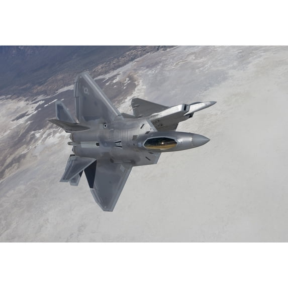 Two F-22 Raptors maneuver while on a training mission over Mexico Poster Print