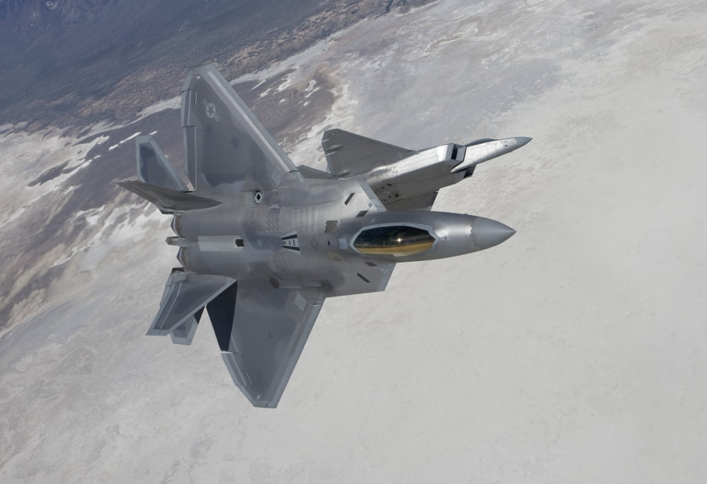 Two F-22 Raptors maneuver while on a training mission over New Mexico Canvas Art - HIGH-G ProductionsStocktrek Images (35 x 24)
