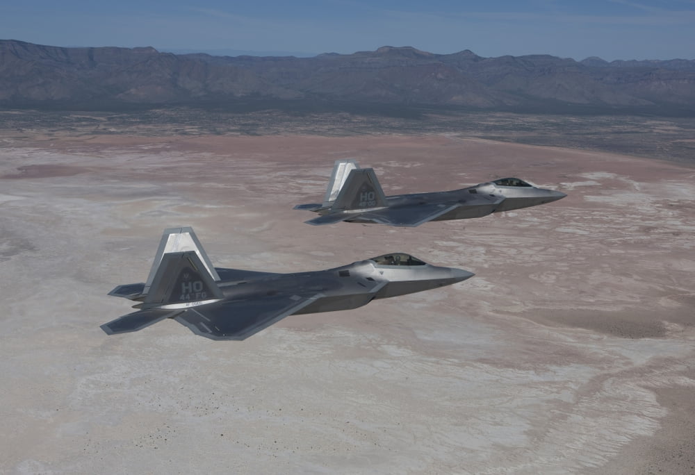 Two F-22 Raptors on a training mission over New Mexico Canvas Art - HIGH-G ProductionsStocktrek Images (35 x 24)
