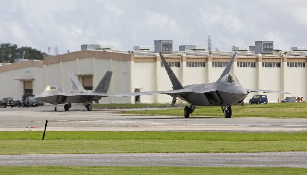Two F-22 Raptors taxi to the end of runway at Kadena Air Base Japan Canvas Art - HIGH-G ProductionsStocktrek Images (19 x 11)