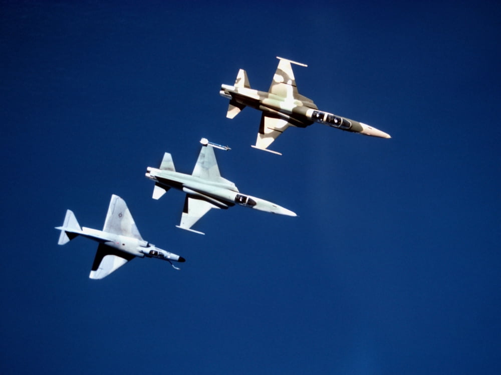 Two F-5 Tiger IIs and an A-4E Skyhawk in flight above the Pacific Ocean Canvas Art - Dave BaranekStocktrek Images (33 x 25)