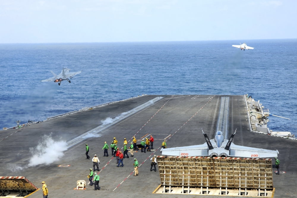 Two FA-18 Hornets take off from the aircraft carrier USS Ronald Reagan Canvas Art - Stocktrek Images (35 x 23)