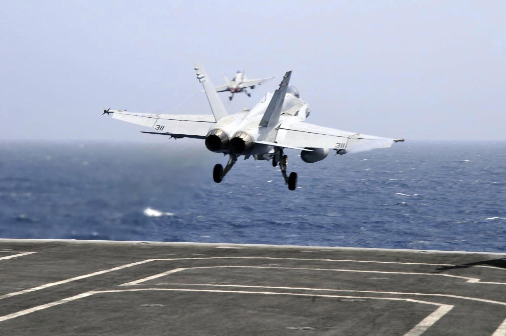 Two FA-18C Hornet strike fighters launch from the aircraft carrier USS Ronald Reagan Canvas Art - Stocktrek Images (35 x 23)