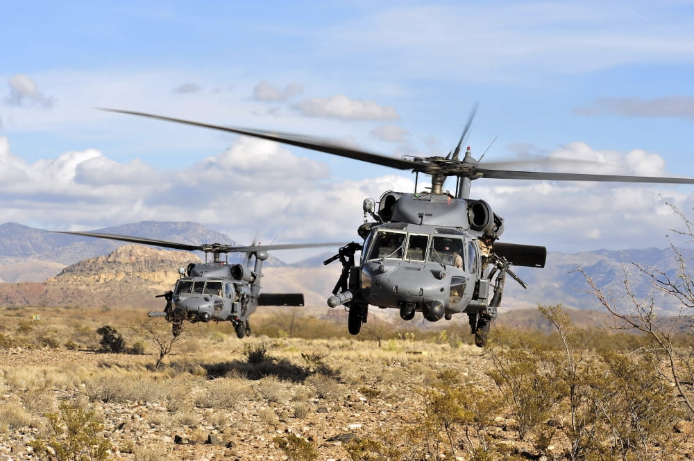Two HH-60 Pavehawk helicopters preparing to land Canvas Art - Stocktrek Images (34 x 23)