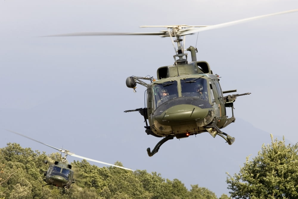 Two Italian Air Force AB-212 ICO helicopters practice low level flying Canvas Art - Erik RoelofsStocktrek Images (35 x 23)