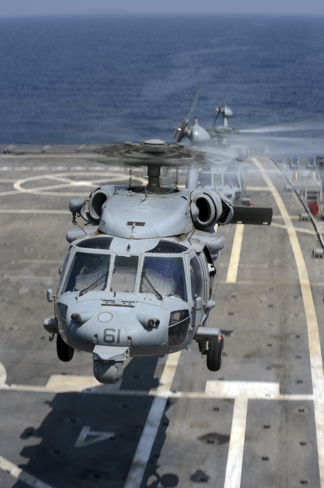 Two MH-60S Sea Hawk helicopters take off from USS Ponce Canvas Art - Stocktrek Images (23 x 34)