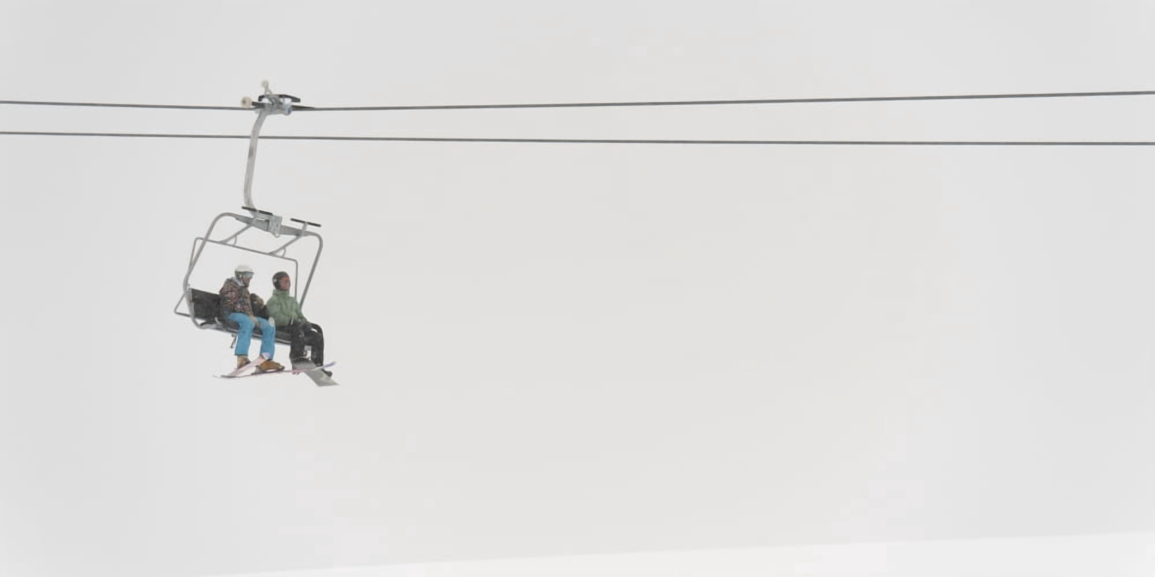 Two People Riding A Chairlift At A Ski Resort Whistler British Columbia Canada Canvas Art - Keith Levit  Design Pics (22 x 11)