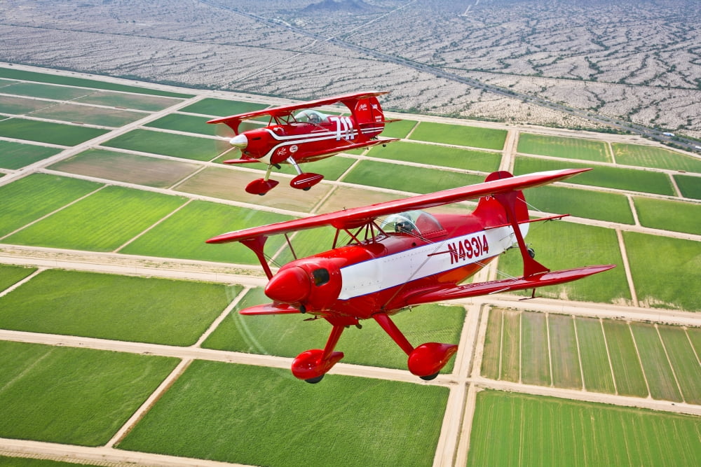 Two Pitts Special S-2A aerobatic biplanes in flight near Chandler Arizona Canvas Art - Scott GermainStocktrek Images (35 x 23)