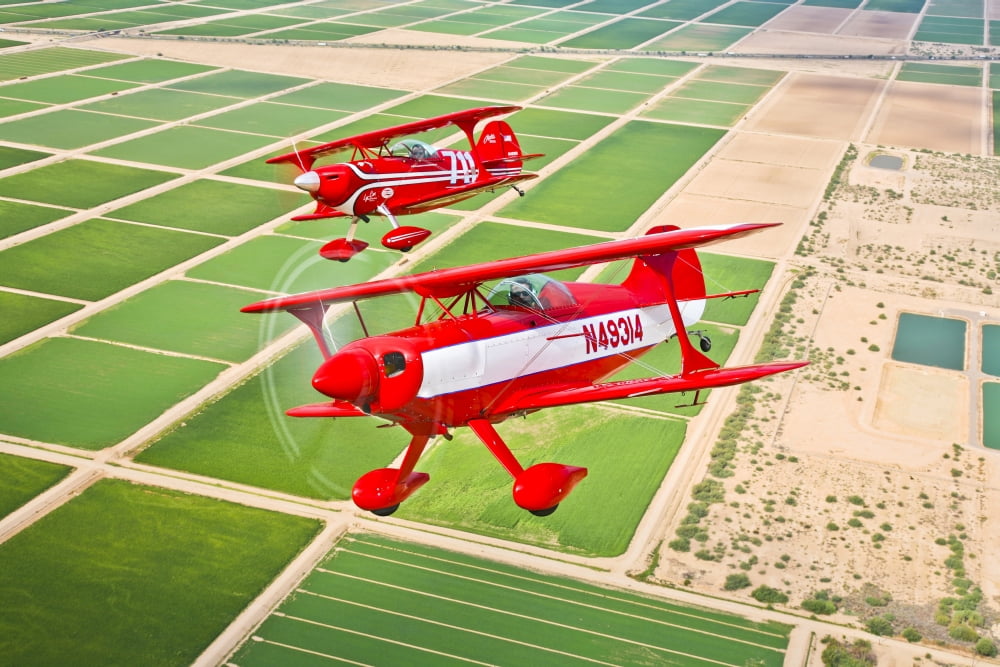 Two Pitts Special S-2A aerobatic biplanes in flight near Chandler Arizona Canvas Art - Scott GermainStocktrek Images (35 x 23)