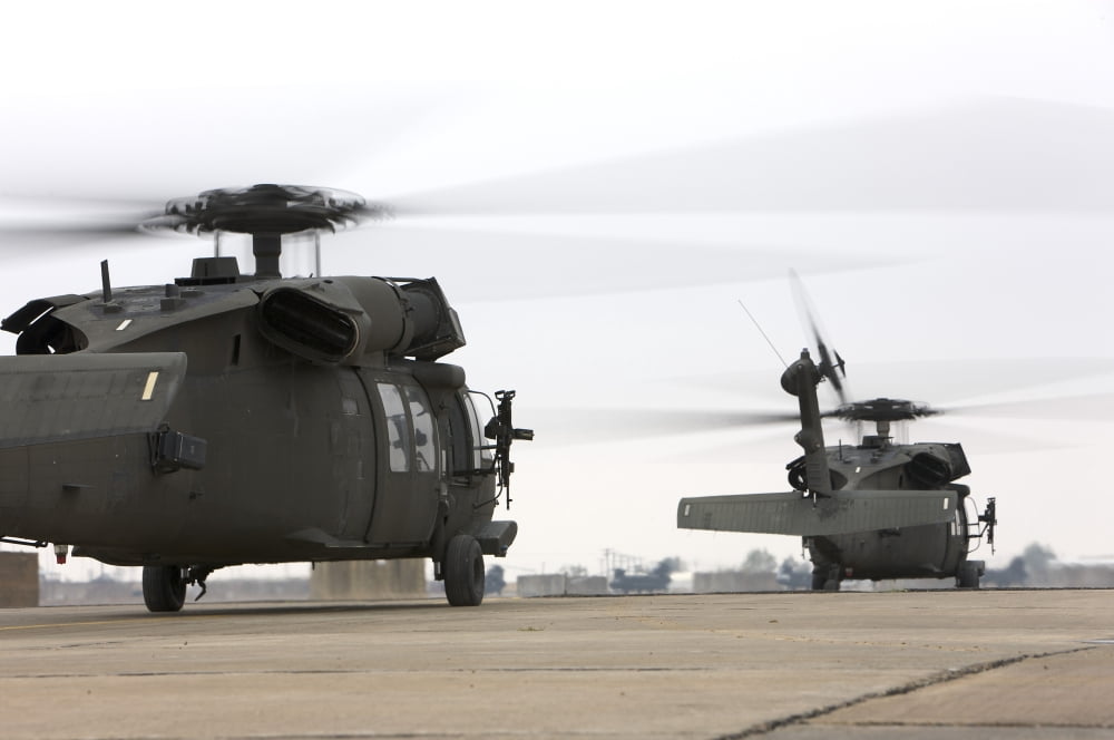 Two UH-60 Black Hawks taxi out for a mission over northern Iraq Canvas Art - Terry MooreStocktrek Images (35 x 23)