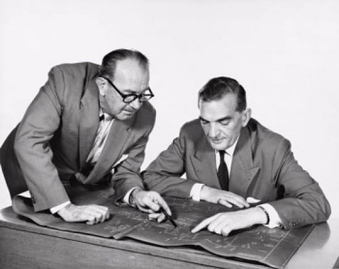 Two architects discussing a blueprint Canvas Art - (24 x 36)