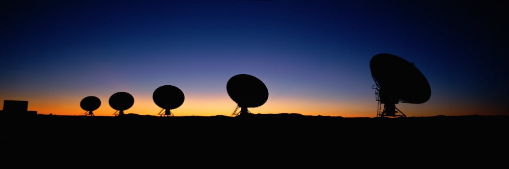 Two arraysatellite dishes in different directions at dusk Canvas Art - Panoramic Images (27 x 9)
