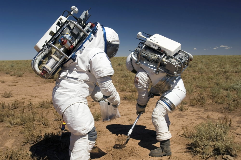 Two astronauts collect soil samples during Desert RATS activity in Arizona Canvas Art - Stocktrek Images (34 x 23)