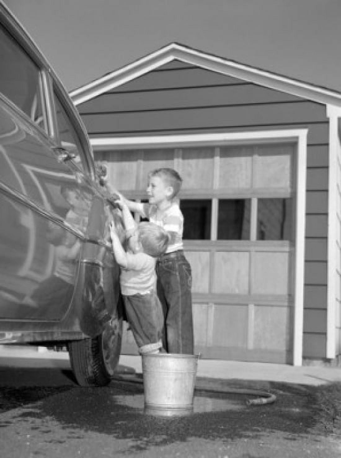 Two boys cleaning car in front of house Canvas Art - (18 x 24)