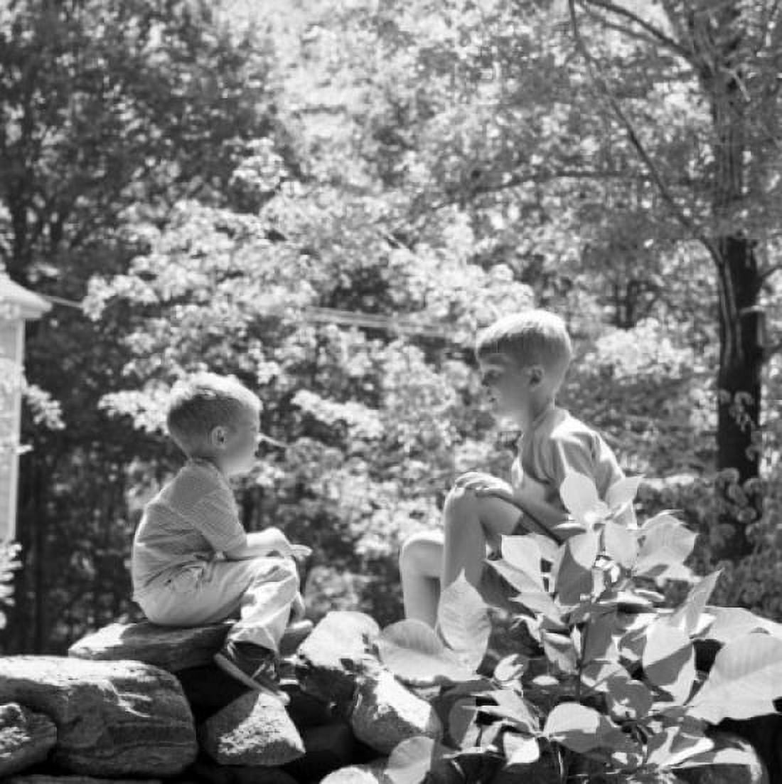 Two boys in woods on rock talking Canvas Art - (18 x 24)