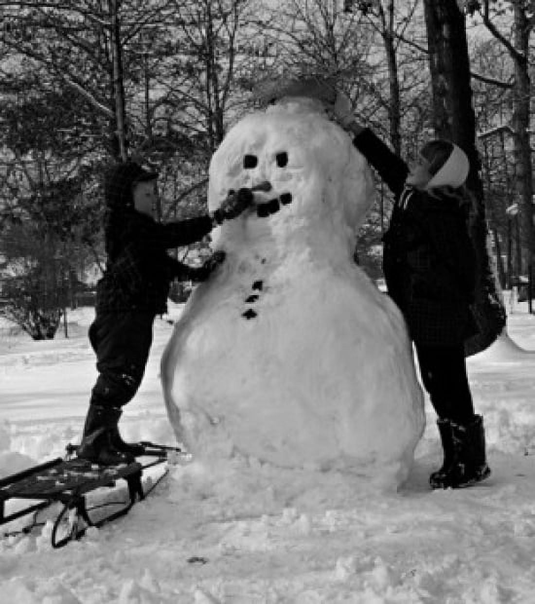 Two boys making snowman Canvas Art - (18 x 24)