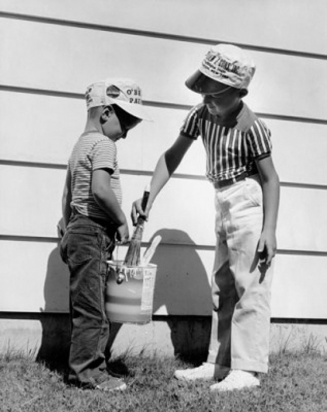Two boys painting a wall Canvas Art - (18 x 24)