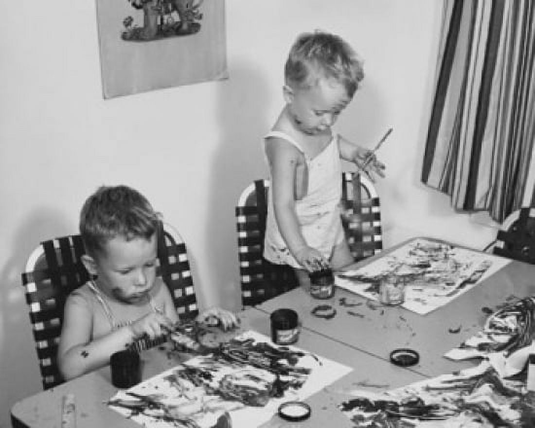 Two boys painting at a table Canvas Art - (18 x 24)