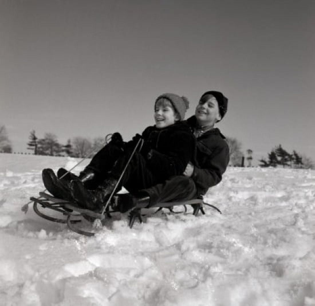 Two boys riding sled Canvas Art - (18 x 24)