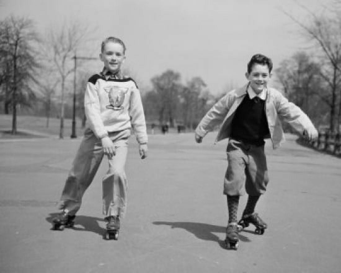 Two boys roller skating in park Canvas Art - (24 x 36)