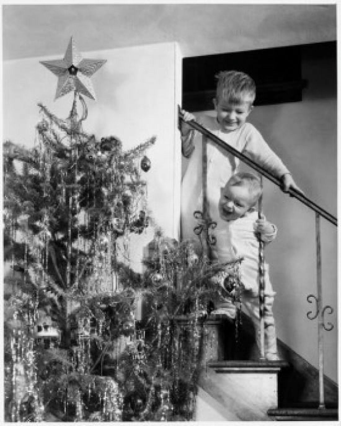 Two boys standing on a staircase and looking at a Christmas tree Canvas Art - (18 x 24)