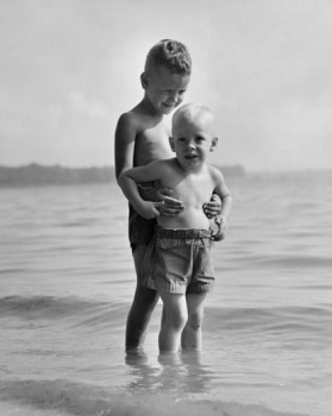 Two boys standing on the beach Canvas Art - (24 x 36)