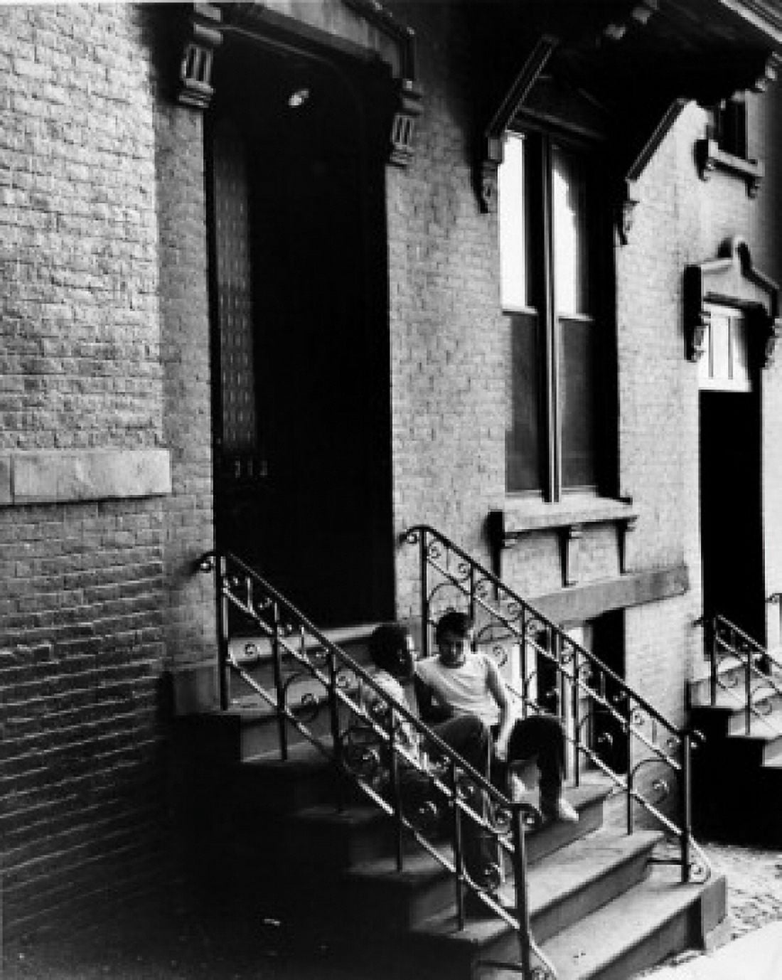 Two boys talking on front stoop Canvas Art - (24 x 36)