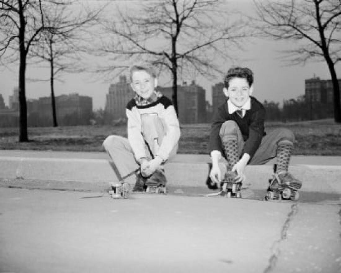 Two boys with roller skates sitting on curb Canvas Art - (18 x 24)
