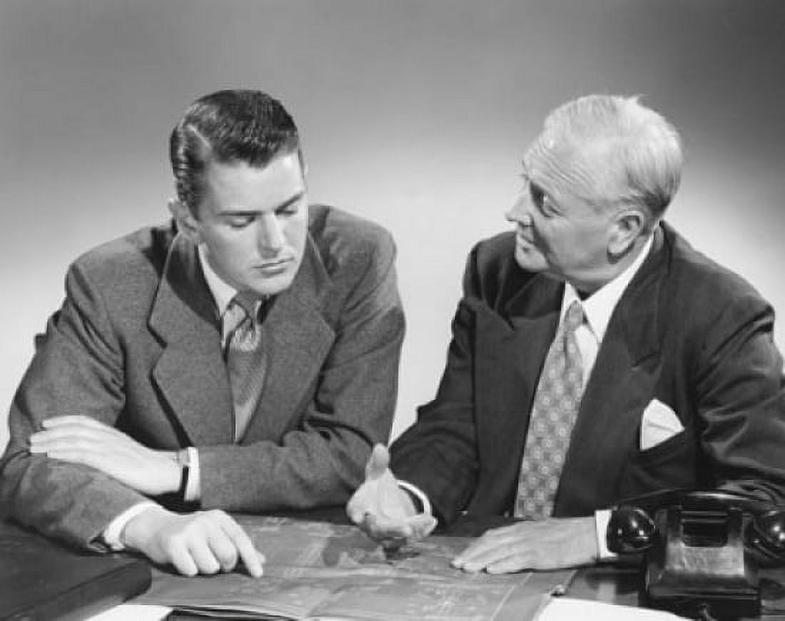 Two businessmen discussing a blueprint in an office Canvas Art - (18 x 24)