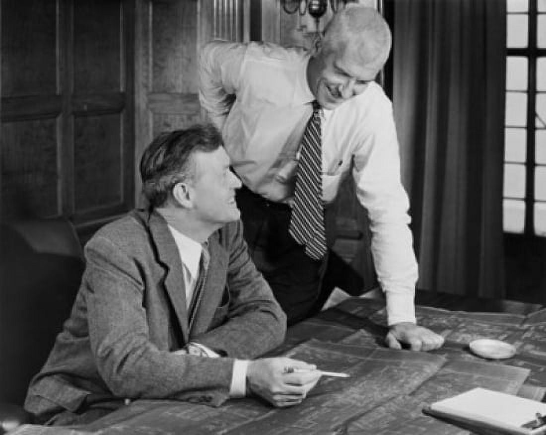 Two businessmen discussing blueprint in office Canvas Art -  (24 x 36)
