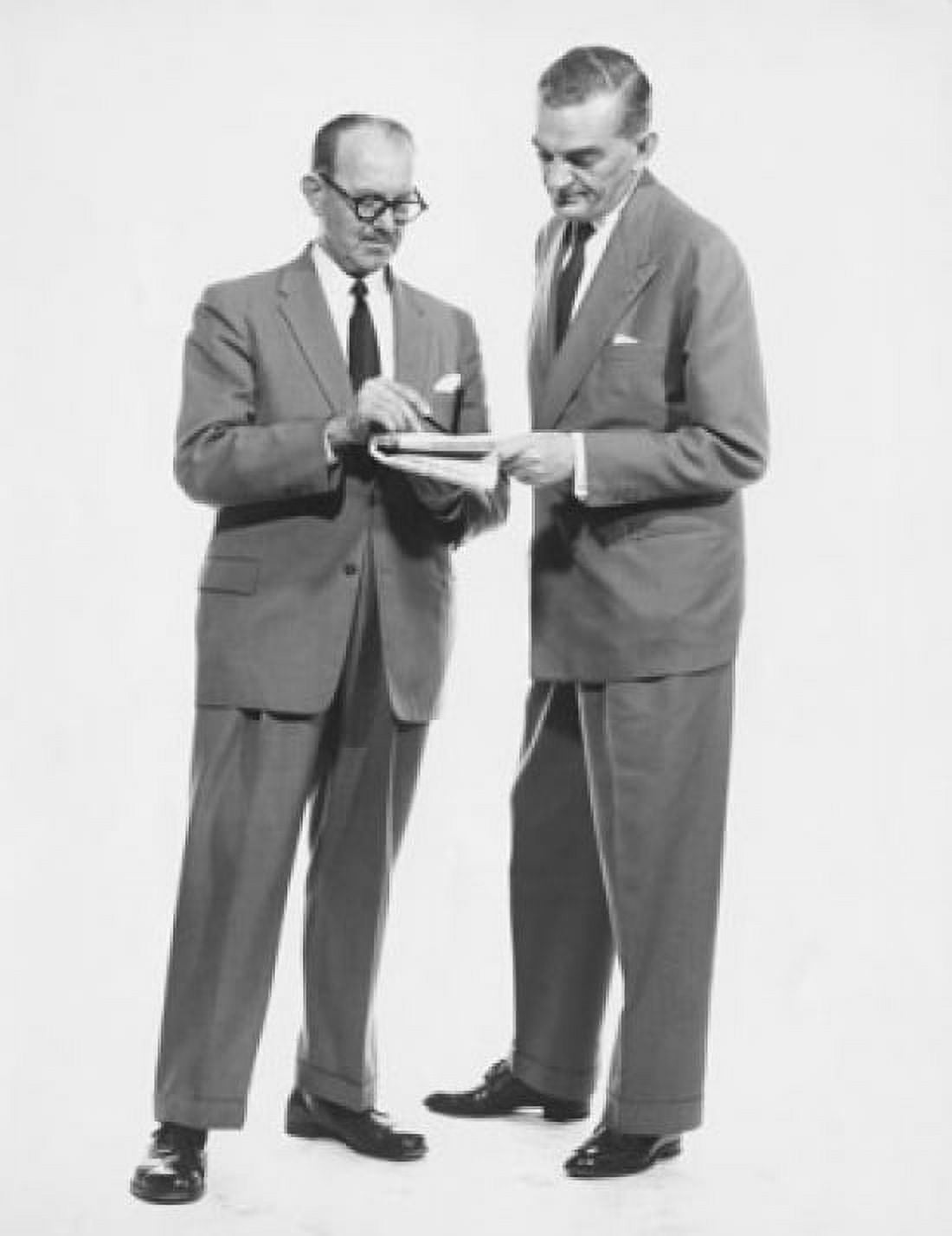Two businessmen reading newspaper Canvas Art - (18 x 24)