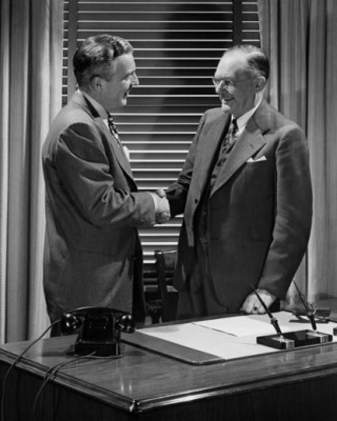Two businessmen shaking hands Canvas Art - (24 x 36)