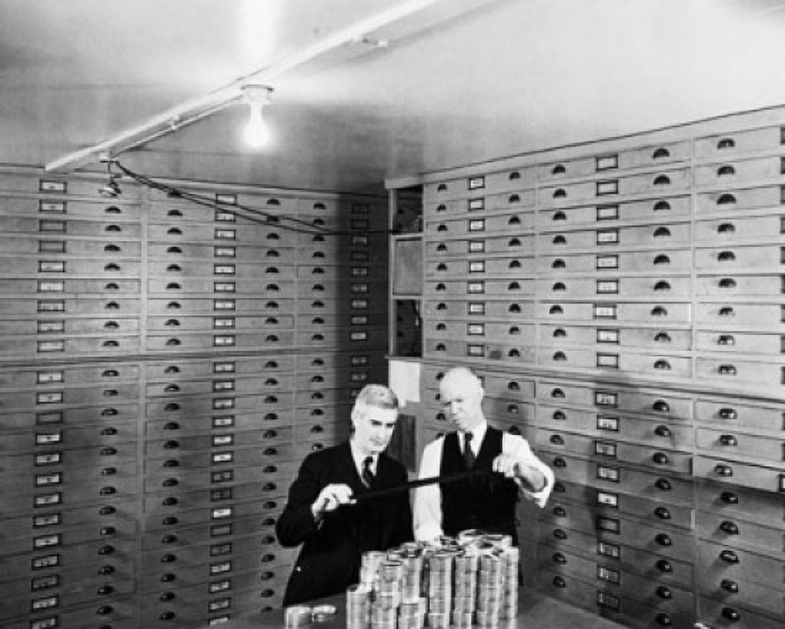 Two businessmen standing in a Microfilm Vault Canvas Art - (18 x 24)