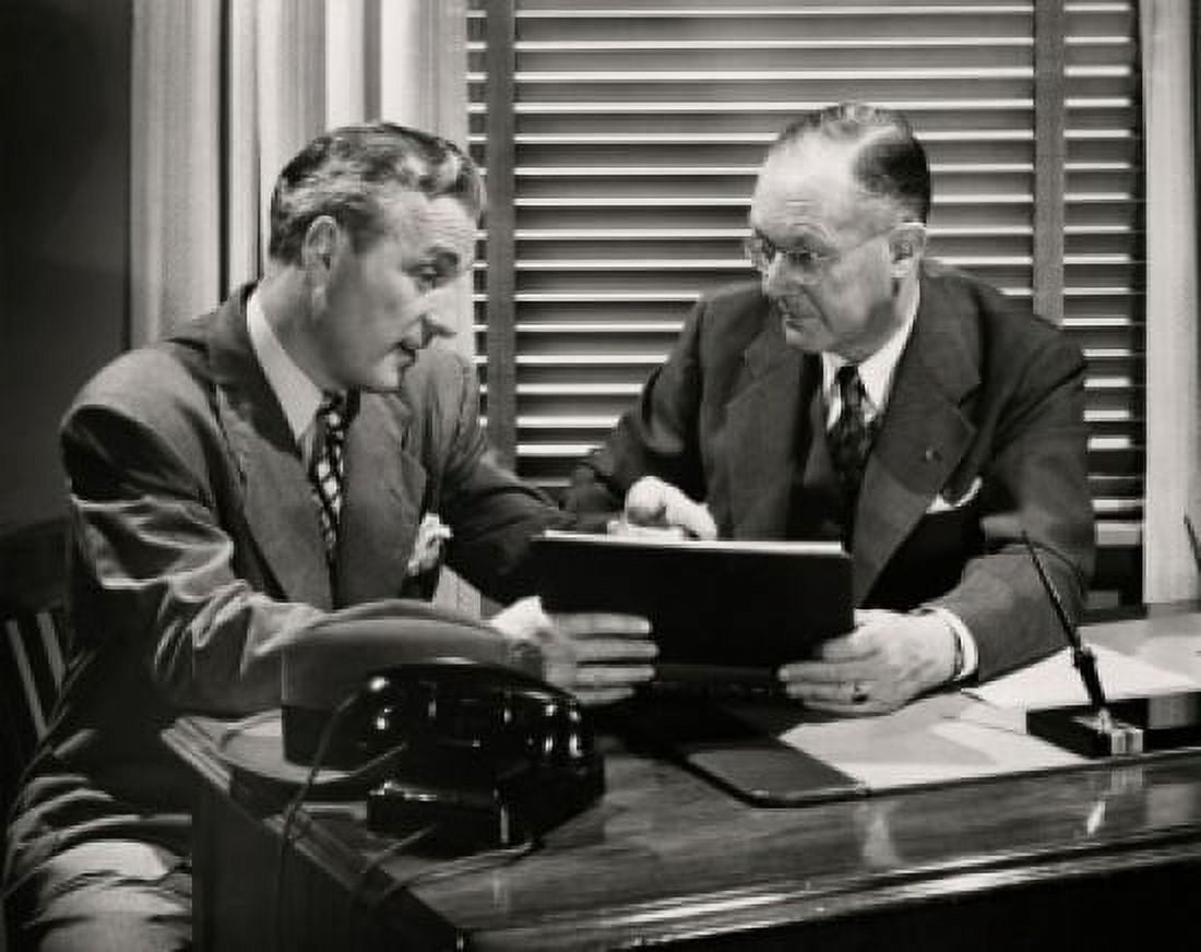 Two businessmen talking in an office Canvas Art - (18 x 24)