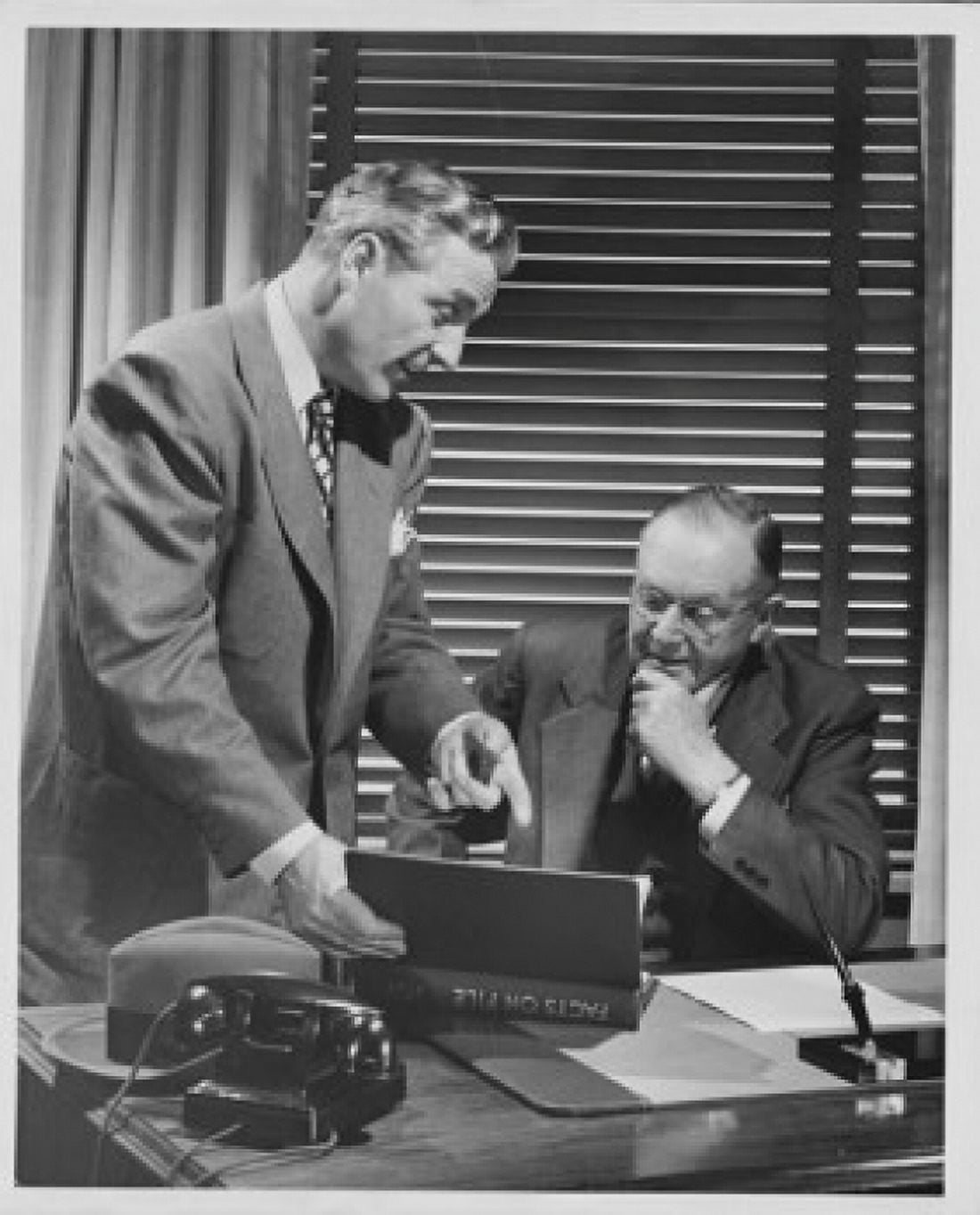 Two businessmen talking to each other in an office Canvas Art - (18 x 24)