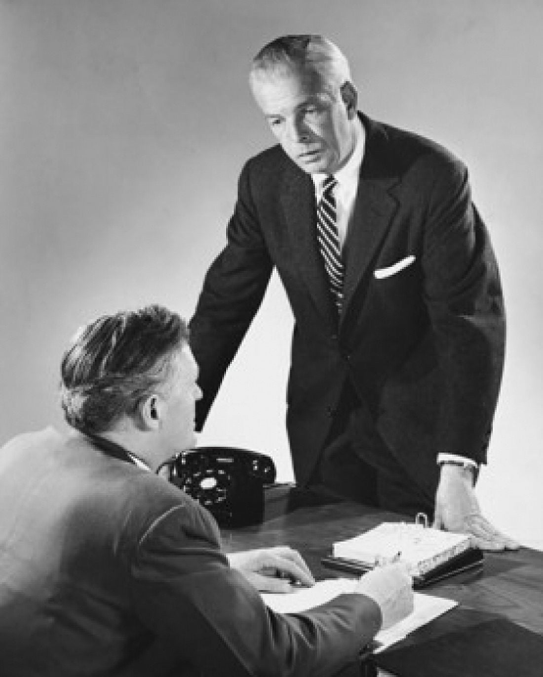 Two businessmen talking to each other in an office Canvas Art - (24 x 36)