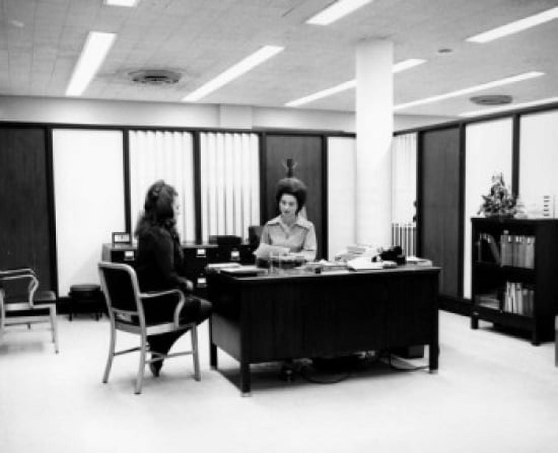 Two businesswomen talking in an office Canvas Art - (24 x 36)